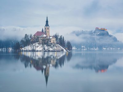 Lake Bled with St. Marys Church of the Assumption on the small island; Bled, Slovenia, Europe